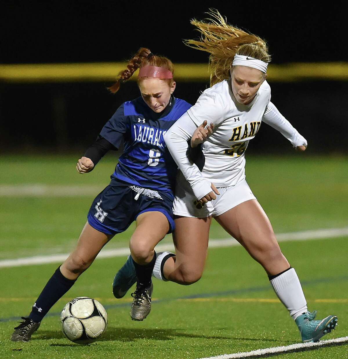Hand senior captain Gabby Egidio controls the ball as Lauralton Hall junior Emma Koerner defends in the second round of the Class L state soccer tournament, Thursday, Nov. 9, 2017, at Strong Field at the Surf Club in Madison. Hand won, 3-0.
