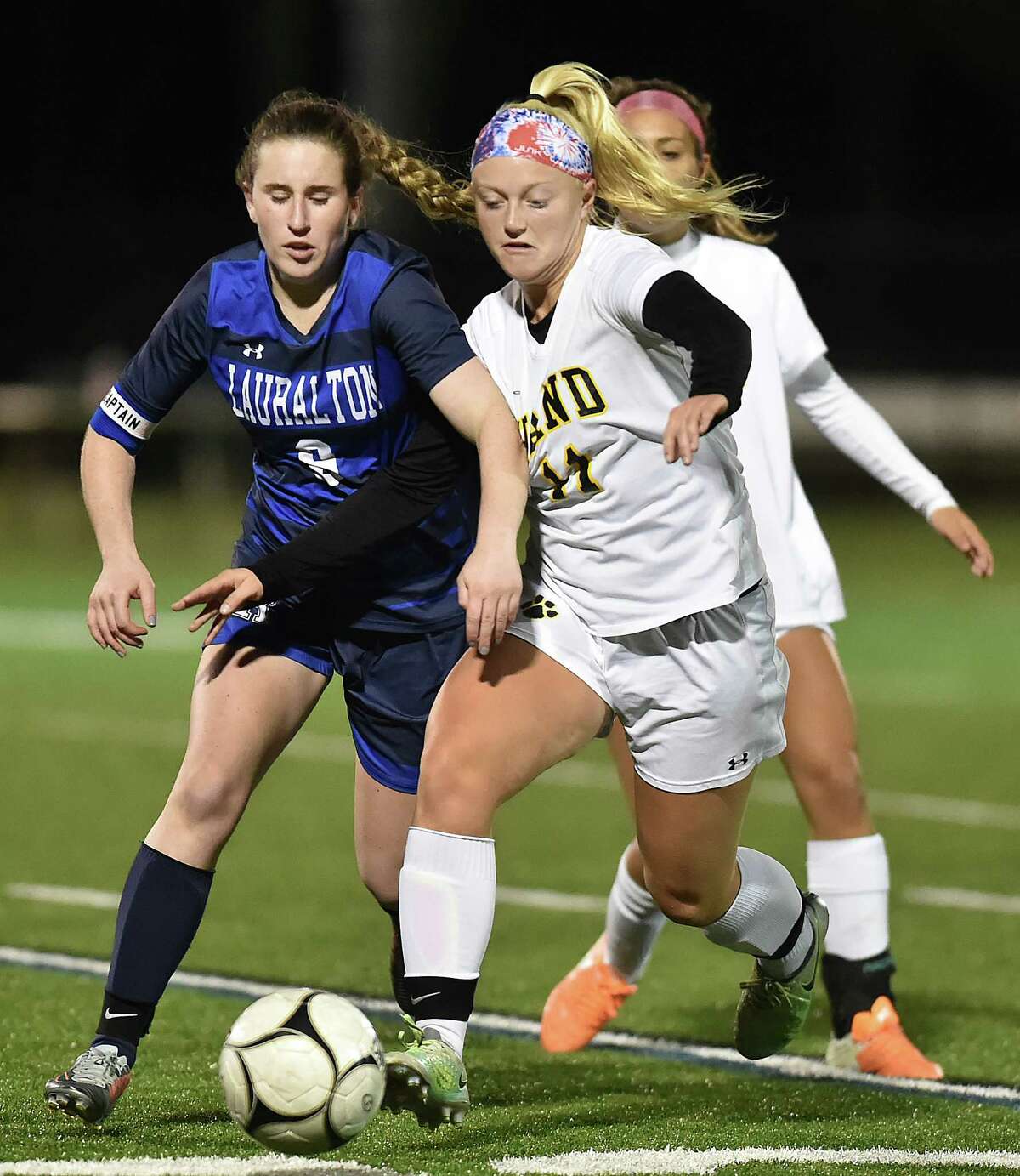Hand senior midfielder Riley Kokoruda controls the ball as Lauralton Hall junior captain Emma Koerner defends in the second round of the Class L state soccer tournament, Thursday, Nov. 9, 2017, at Strong Field at the Surf Club in Madison. Hand won, 3-0.