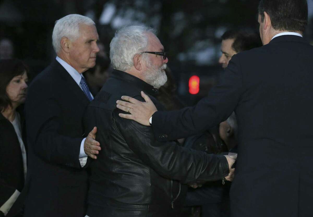 U. S. Vice President Mike Pence reaches out to Stephen Willeford during a visit to the Sutherland Springs, Texas First Baptist Church, Wednesday, Nov. 8, 2017. On Sunday, Willeford and Johnnie Langendorff were credited with stopping Devin Patrick Kelley, 26, after he shot dead 26 women, children and men and injuring dozens others inside the church on Sunday.