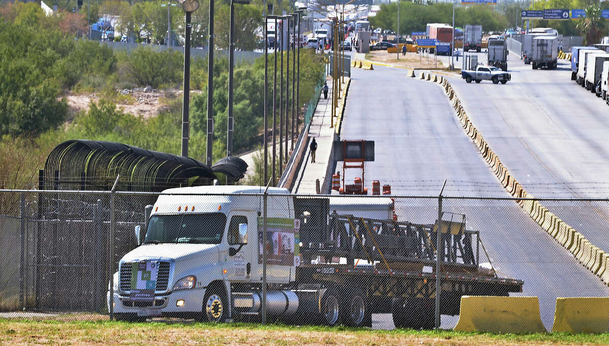 The first commercial truck from Mexico that will travel to Garland, Texas from Apocada, Nuevo Leon, Mexico, crosses the World Trade Bridge from Nuevo Laredo, Tamaulipas, Mexico into Laredo, Texas, Friday, Oct. 21, 2011. For the first time under the North American Free Trade Agreement, a Mexican tractor-trailer has crossed the border into the U.S. on its way into the country's interior. The NAFTA trucking program was stalled for years by concerns that it would put highway safety and American jobs at risk. But the commercial truck hauling a steel drilling structure entered the United States on Friday afternoon, nearly two decades after passage of the agreement, which was supposed to improve cargo transportation between the two countries. (AP Photo/The Laredo Morning Times, Ricardo Santos)