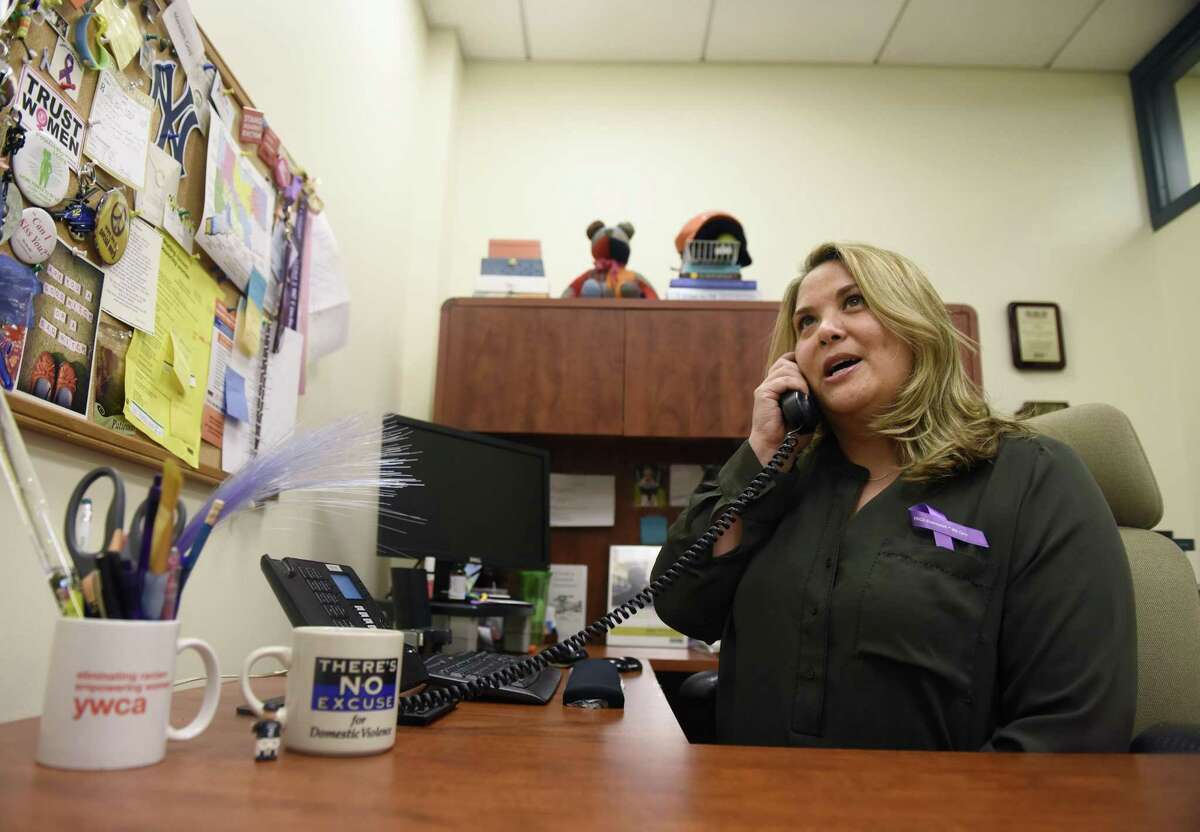 YWCA Greenwich Director of Domestic Abuse Services Meredith Gold poses in her office at the YWCA in Greenwich, Conn. Wednesday, Oct. 25, 2017. YWCA Greenwich offers many domestic abuse services, including a 24-hour hotline, immediate assistance, counseling services, emergency shelter, safety planning, children's services, court services, and resources for immigrants.