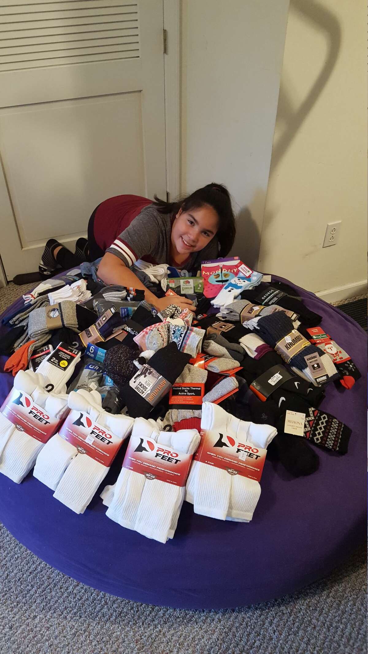 Eleven-year-old Seymour Middle School student Adelina "Lulu" Barreira collected 4,147 pairs of sockss to donate to local charities through her project, "Lulu's Socktober Fest."