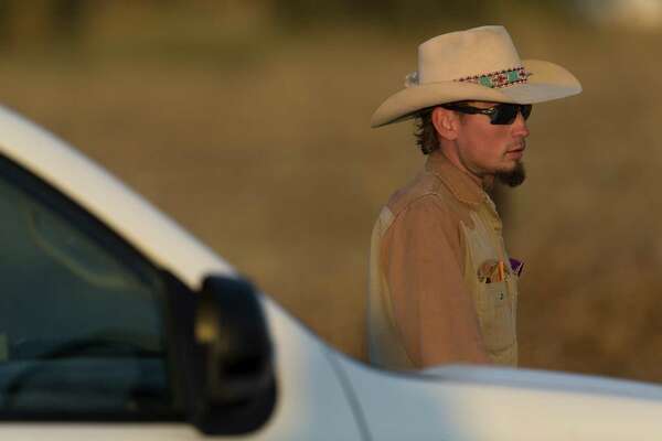 Johnnie  Langendorff, who pursued the suspect of the Sutherland Springs First Baptist Church shooting, waits Sunday, Nov. 5, 2017, to be picked  up from the scene where the gunman died near the intersection of FM 539  and Sandy Elm Road in Guadalupe County.