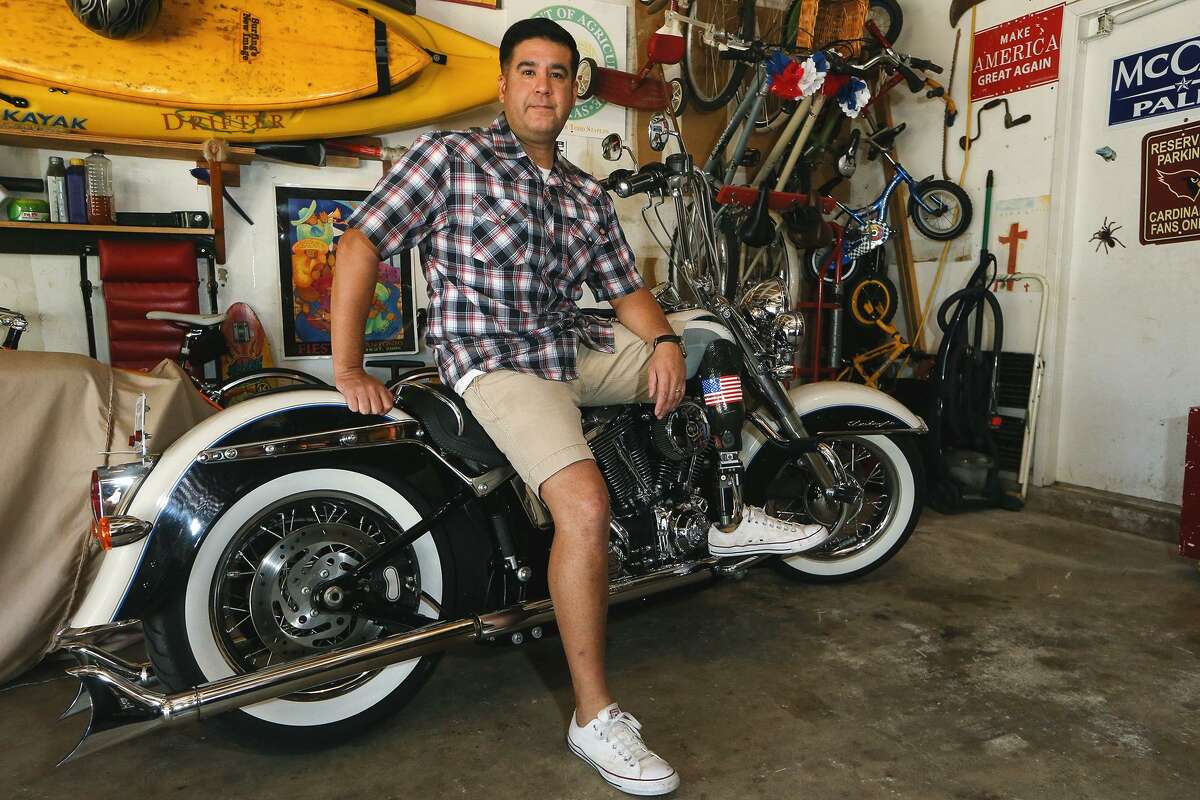 Army Sgt.1st Class Gabriel Monreal in his garage with his 2012 Harley Davidson Softail Deluxe on Oct. 25. Monreal has served for 20 years including tours in both Iraq and Afghanistan.