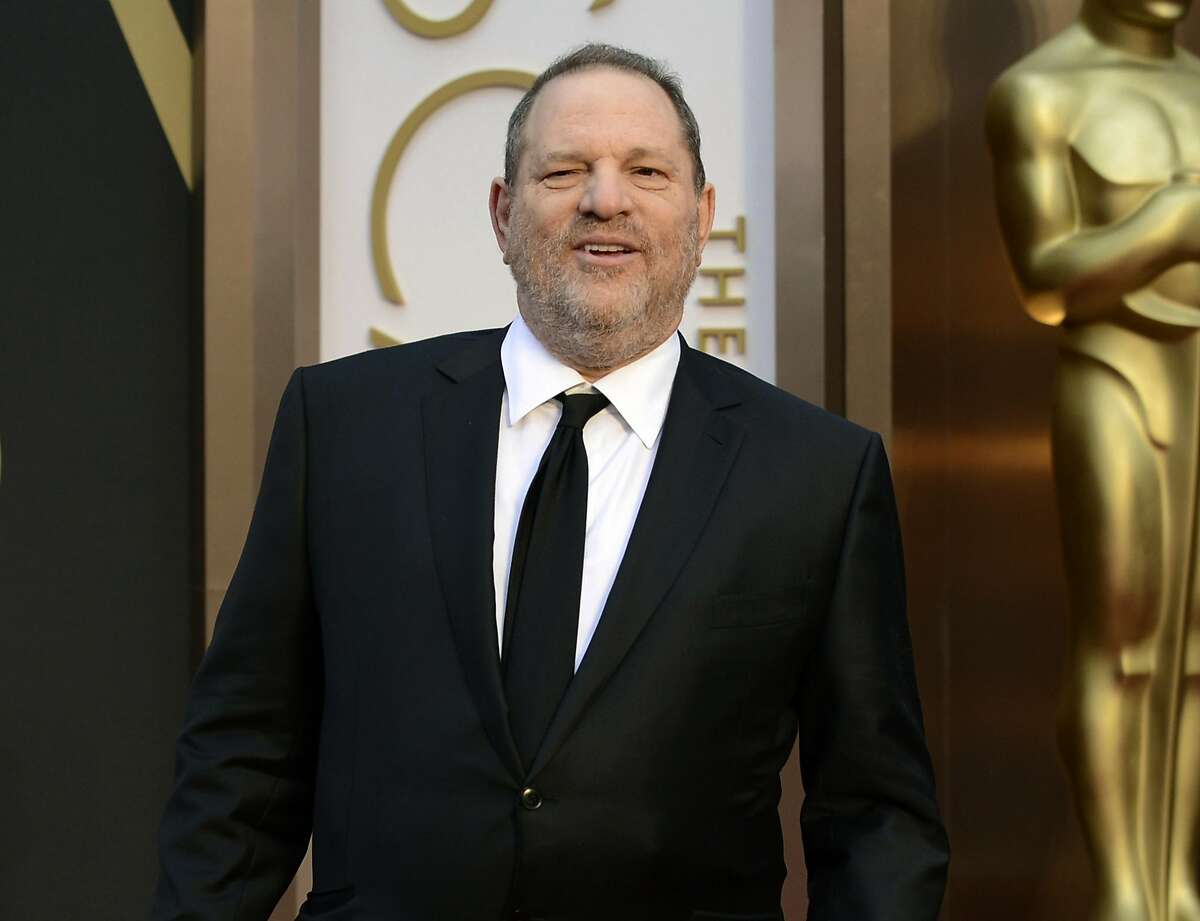 FILE - In this March 2, 2014 file photo, Harvey Weinstein arrives at the Oscars at the Dolby Theatre in Los Angeles. Weinstein has been accused by dozens of women of sexual harassment or assault. He was fired by The Weinstein Co. and expelled from various professional guilds. His is currently under investigation by police departments in New York, London, Beverly Hills and Los Angeles and denies all allegations of non-consensual sex. (Photo by Jordan Strauss/Invision/AP, File)