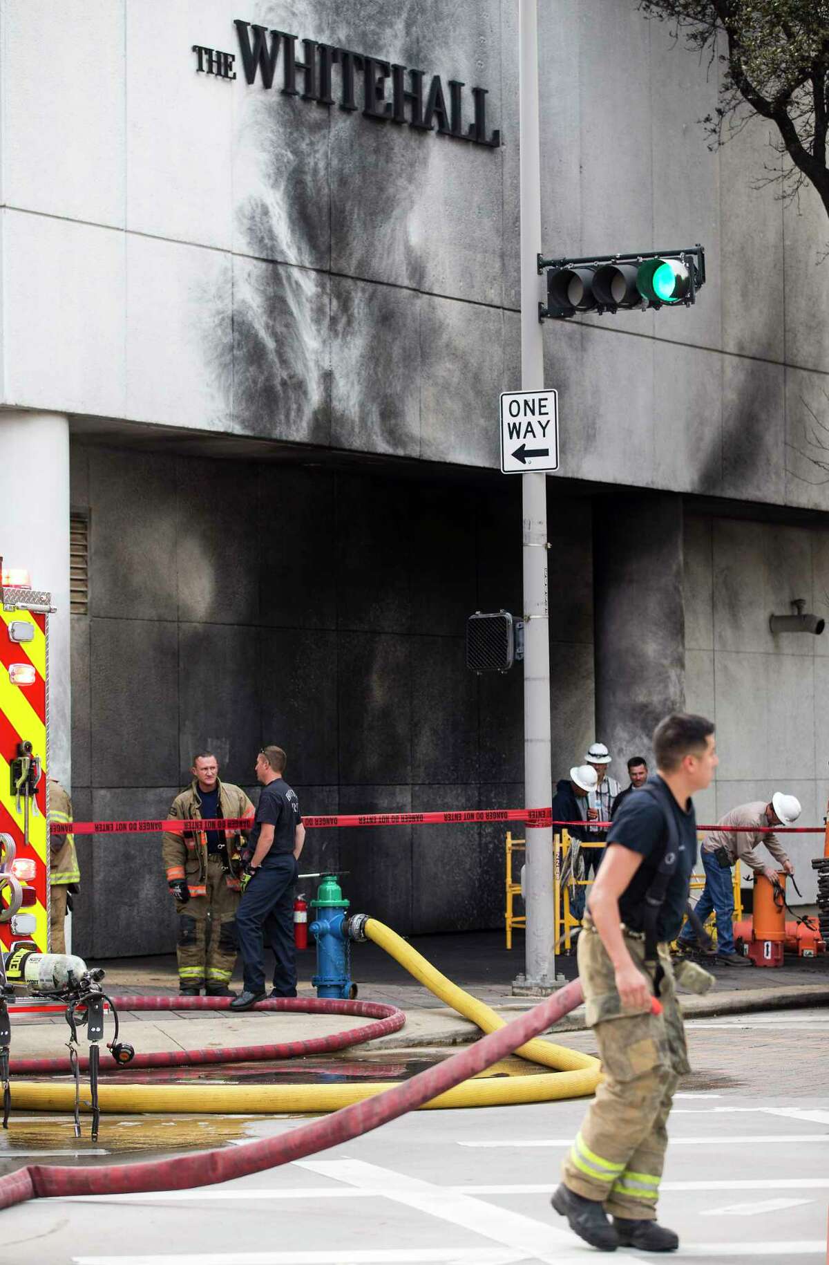Houston firefighters work the scene of an explosion Friday at The Whitehall Hotel downtown. One person was transported to a hospital with life-threatening injuries, Deputy Chief Blake White said.