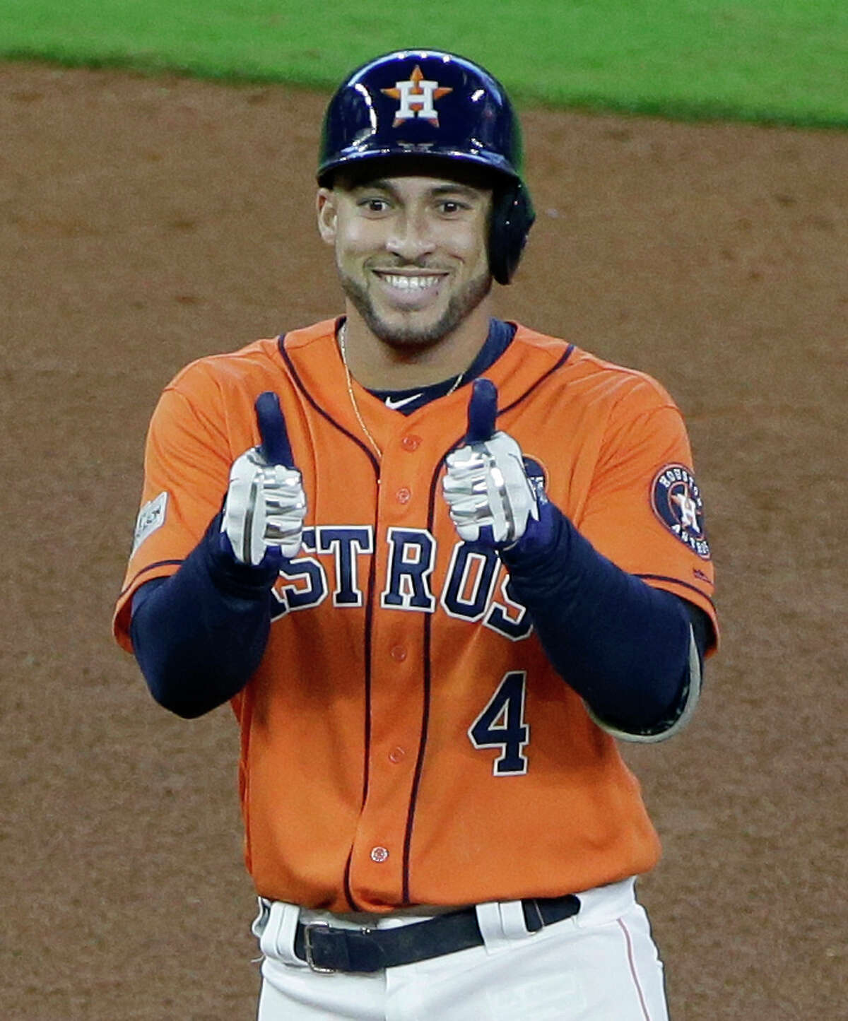 Houston Astros George Springer gives thumbs up as he stands on base after a double hit against the Boston Red Sox in Game 2 of the American League Division Series at Minute Maid Park on Oct. 6, 2017. ( Melissa Phillip / Houston Chronicle )
