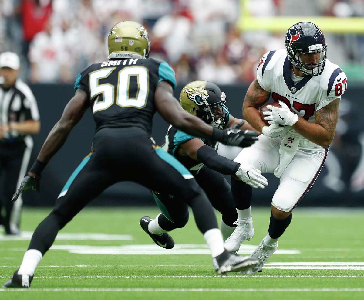 Texans tight end C.J. Fiedorowicz, right, has seen scant action this year after receiving a concussion on this pass reception against the Jaguars in the season opener at NRG Stadium. He got off injured reserve Friday.