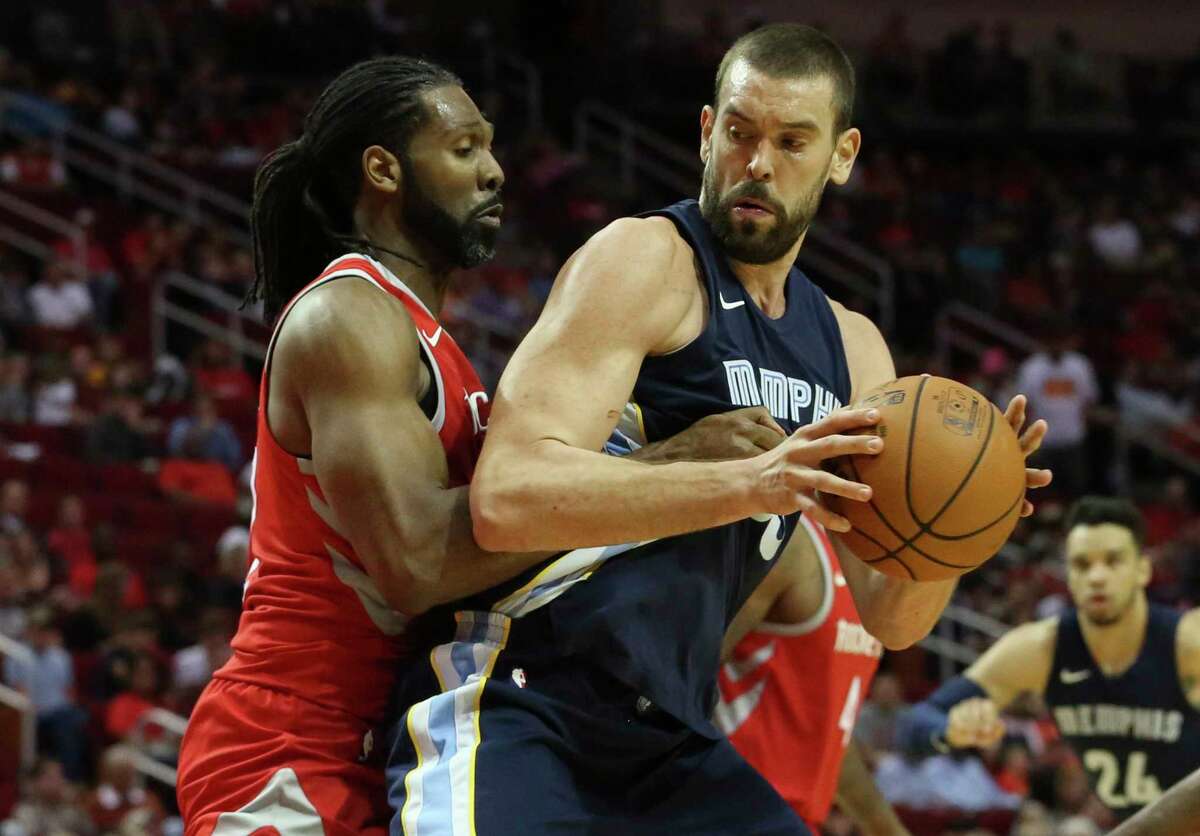 Rockets center Nene, left, gets physical with Grizzlies center Marc Gasol during their Oct. 23 matchup. The Rockets see today's rematch at Toyota Center as critical in the long run.