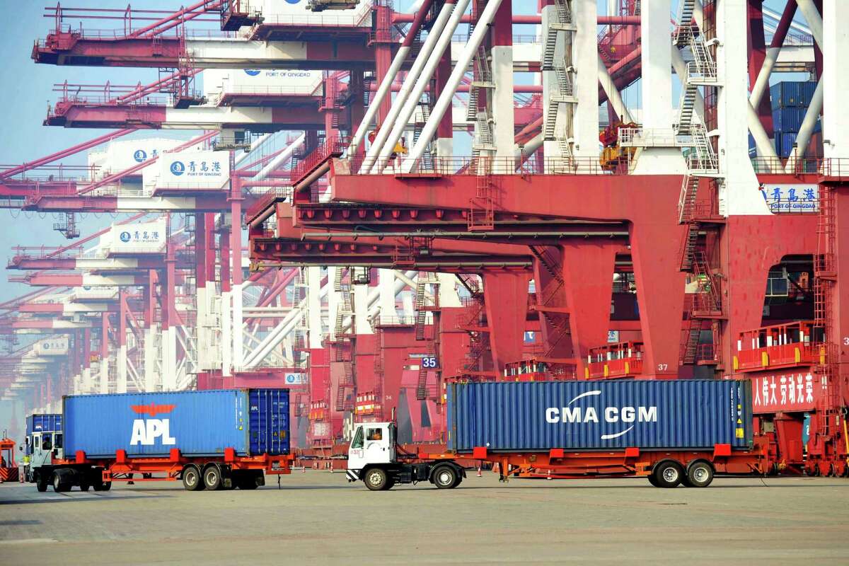 Trucks move shipping containers in Qingdao, in eastern China's Shandong Province. President Donald Trump has targeted some of the sizable trade deficits that the U.S. runs with individual countries. But many economists say a country's trade deficit with individual nations is a pointless measure.