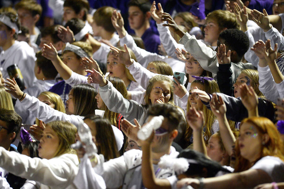 Port Neches-Groves fans do the tomahawk chop during the Mid-County Madness rivalry game against Nederland at Bulldog Stadium on Friday night. Nederland won 36-35. Photo taken Friday 11/10/17 Ryan Pelham/The Enterprise