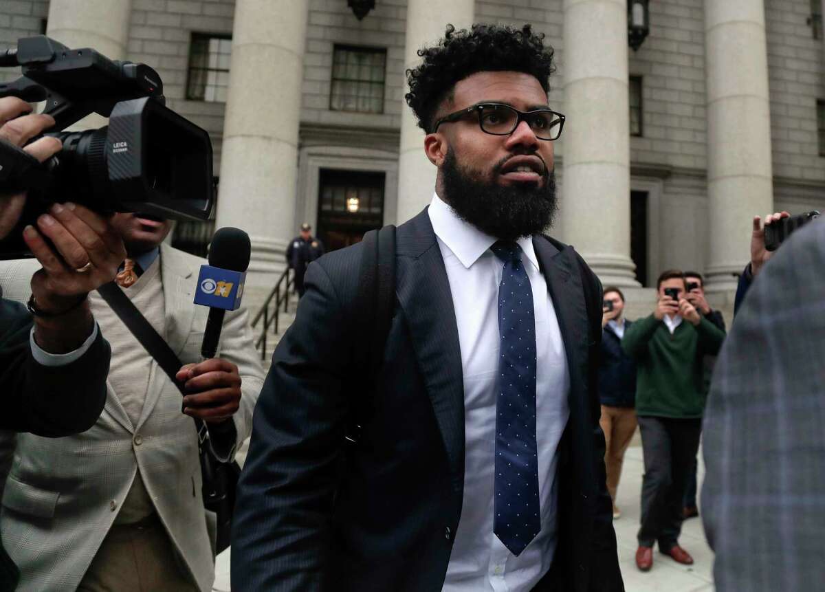 FILE - In this Thursday, Nov. 9, 2017, file photo, Dallas Cowboys NFL football star Ezekiel Elliott walks out of federal court in New York. Elliott's half-season run from his six-game suspension ended when a federal appeals court refused to let him play while it considers his appeal. (AP Photo/Julie Jacobson, File)