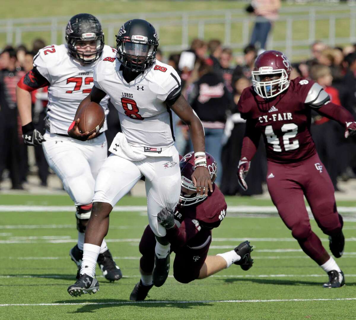 Langham Creek quarterback Chris Herron (8) is caught by Cy-Fair's Patrick Atkinson (30) during the first half of their game Saturday, Nov. 11, 2017, in Houston, TX. (Michael Wyke / For the Chronicle)
