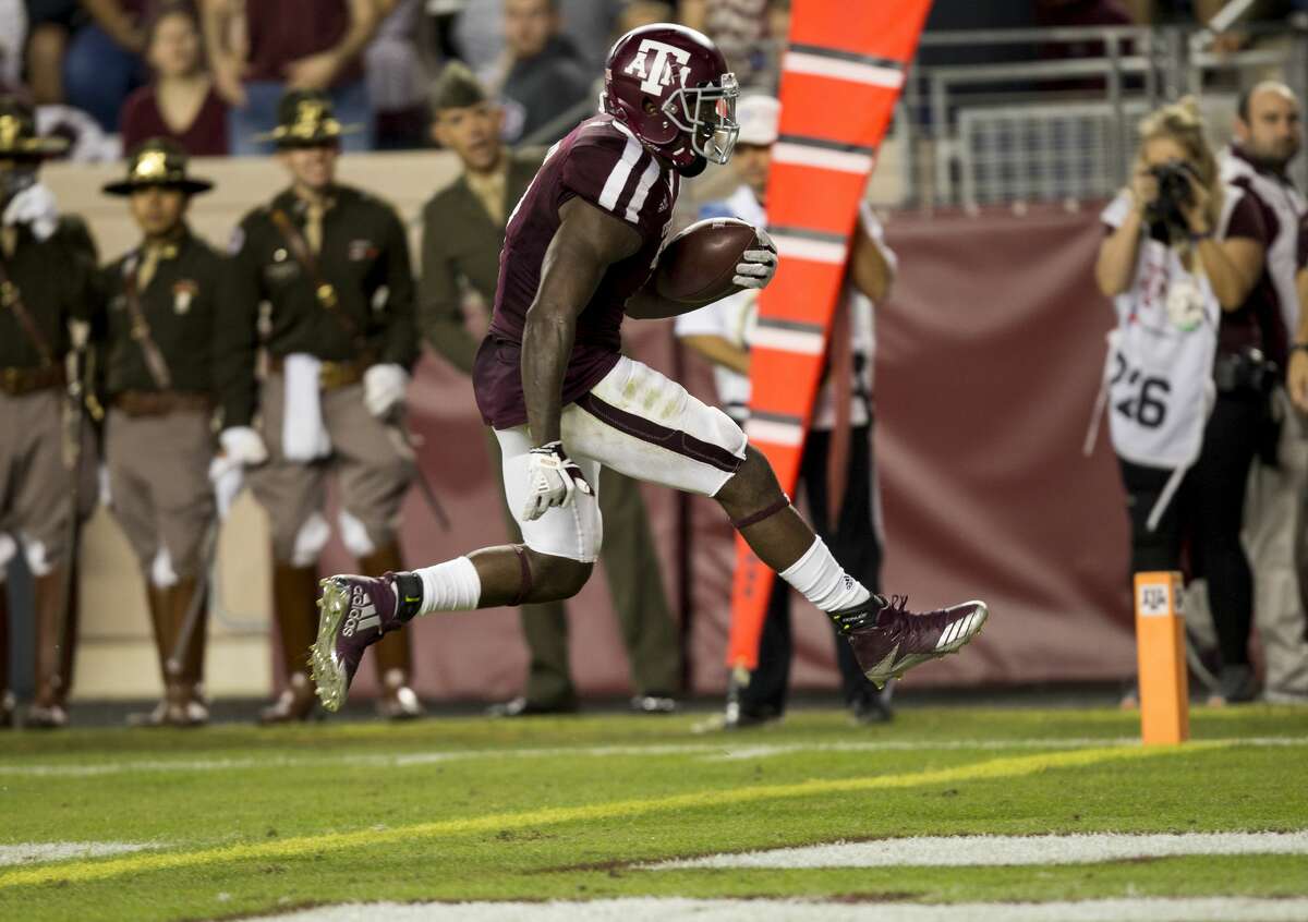 Texas A&M running back Keith Ford (7) skips over the goal line for a touchdown after a 12 yard run against New Mexico during the second quarter of an NCAA college football game on Saturday, Nov. 11, 2017, in College Station, Texas. (AP Photo/Sam Craft)