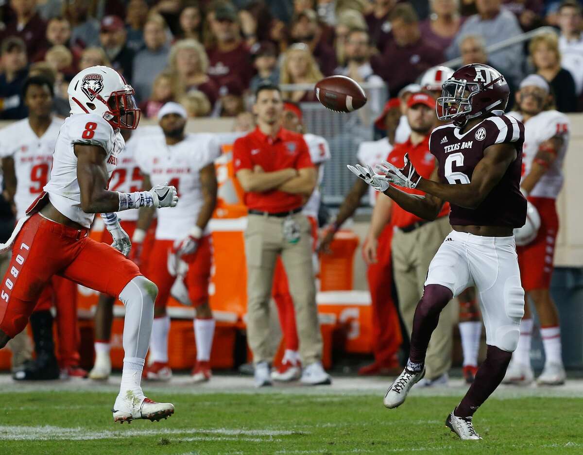 COLLEGE STATION, TX - NOVEMBER 11: Roshauud Paul #6 of the Texas A&M Aggies makes a catch as he slips behind Willie Hobdy #8 of the New Mexico Lobos at Kyle Field on November 11, 2017 in College Station, Texas. (Photo by Bob Levey/Getty Images)