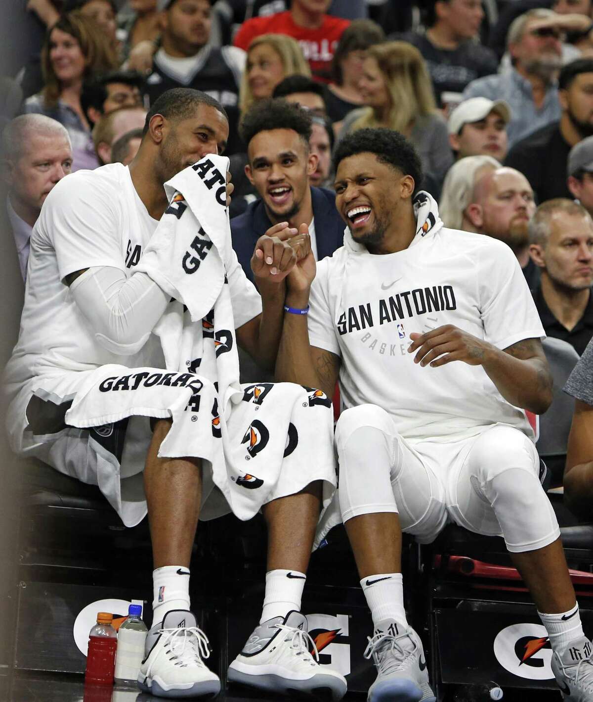 LaMarcus Aldridge #12 of the San Antonio Spurs,L, and Rudy Gay #22 of the San Antonio Spurs enjoy a light moment on the bench during the fourth quarter in a NBA game between San Antonio Spurs Chicago Bulls on Saturday, November 11, 2017.