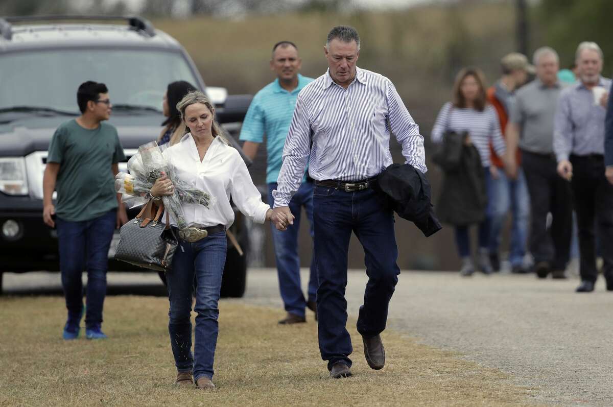 Mourners leaves a worship service for the victims of the shooting at Sutherland Springs Baptist Church, Sunday, Nov. 12, 2017, in Sutherland Springs, Texas, after a man opened fire inside the church last Sunday. Church members will gather this week in a large tent set up at a baseball park. (AP Photo/Eric Gay)
