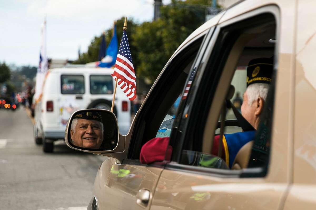 John McCaffrey of the American Legion's Alexander Hamilton Post 448, drives down Jefferson Street during the Veterans Day Parade in San Francisco, Calif. Sunday, November 12, 2017.