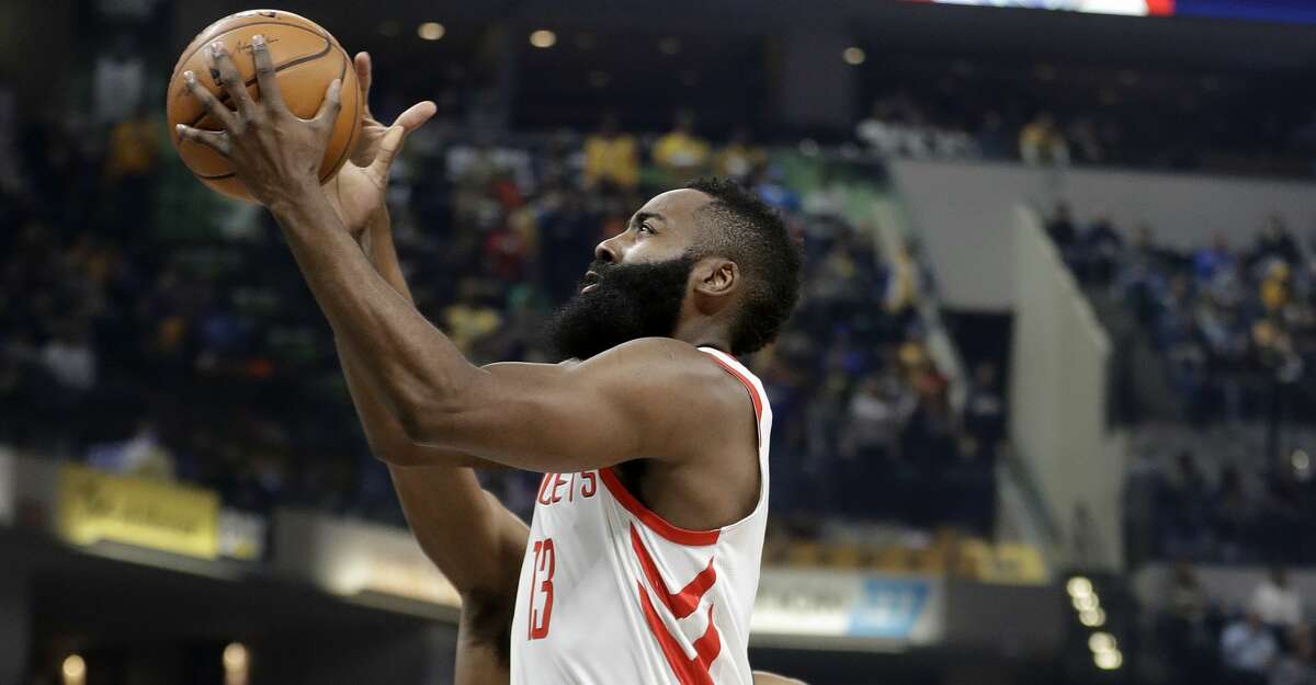 Houston Rockets' James Harden goes to the basket past Indiana Pacers' Thaddeus Young during the first half of an NBA basketball game, Sunday, Nov. 12, 2017, in Indianapolis. (AP Photo/Darron Cummings)