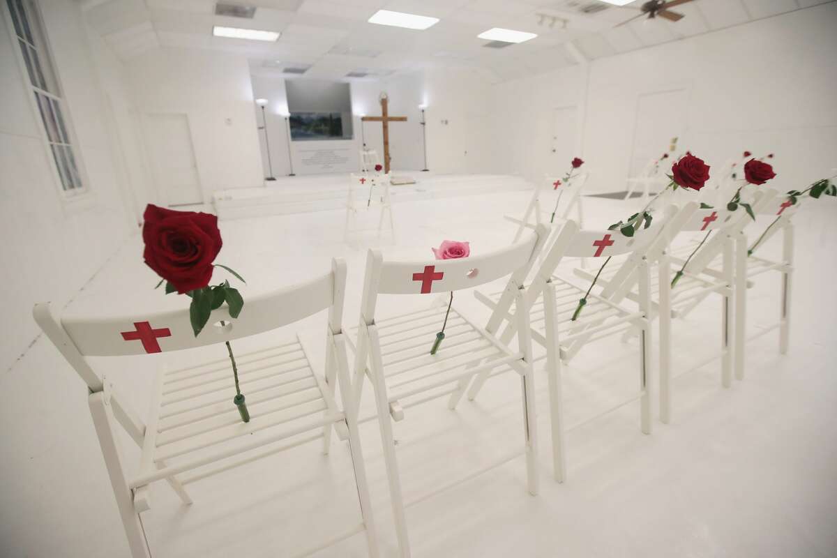 SUTHERLAND SPRINGS, TX - NOVEMBER 12: The First Baptist Church of Sutherland Springs is turned into a memorial to honor those who died on November 12, 2017 in Sutherland Springs, Texas. The inside of the church has been painted white with 26 white chairs placed around the room. On each chair is a single rose and the name of a shooting victim. The chairs are placed throughout the room at the location where the victim died. The memorial will be open to the public. Devin Patrick Kelley shot and killed the 26 people and wounded 20 others when he opened fire during Sunday service at the church on November 5th. (Photo by Scott Olson/Getty Images)