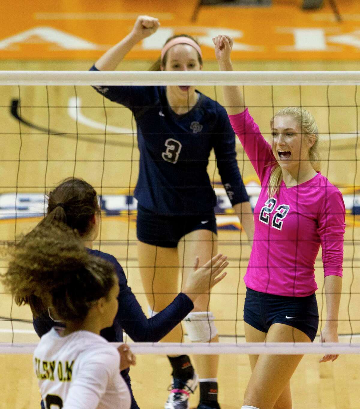 College Park libero CC Clausen (22) celebrates a point during the first set of a Region II-6A semifinal match at Johnson Coliseum, Friday, Nov. 10, 2017, in Huntsville.