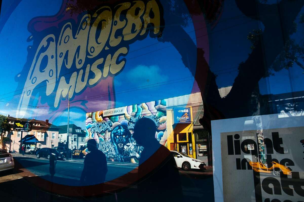 People walk past the Amoeba Music records on Haight Street in San Francisco, Calif. Monday, October 30, 2017.