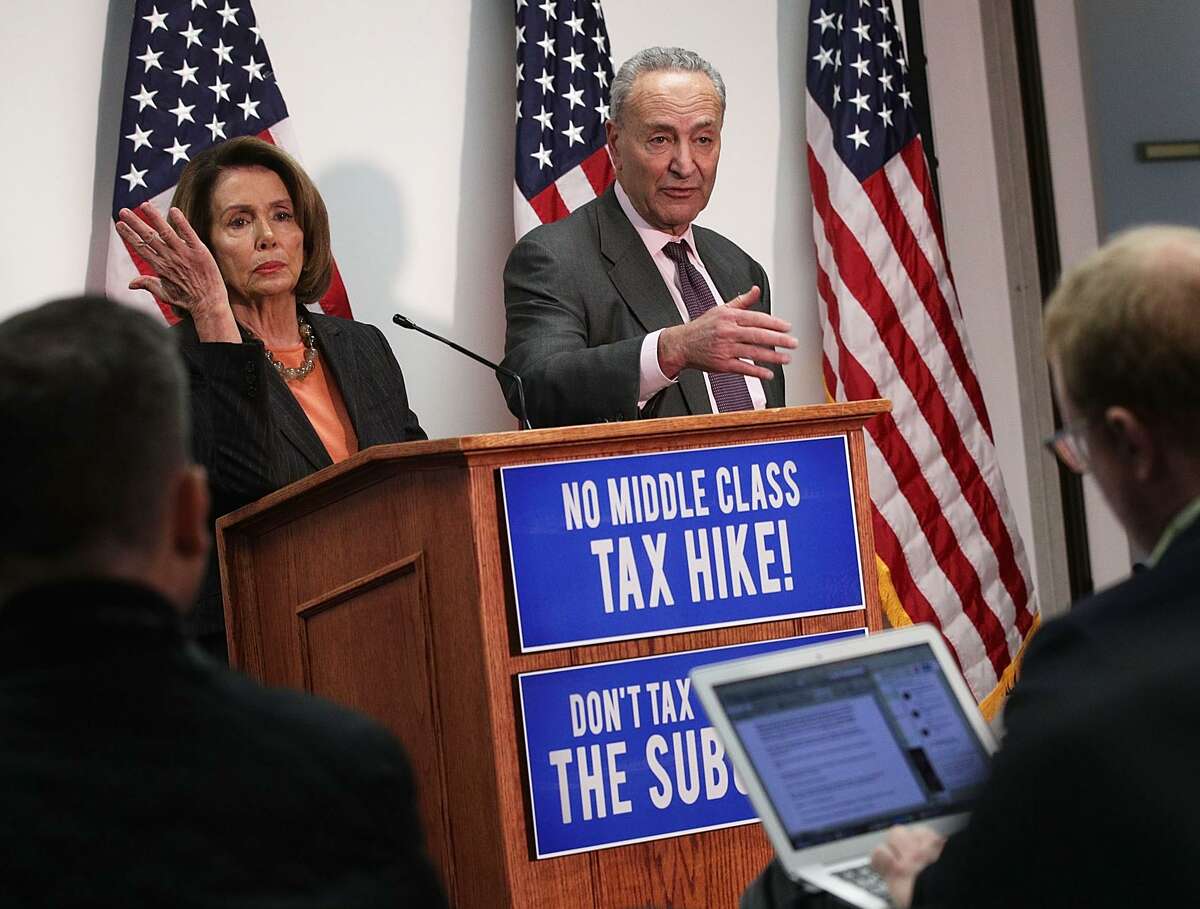 U.S. Senate Minority Leader Sen. Chuck Schumer (D-NY) and House Minority Leader Rep. Nancy Pelosi (D-CA) participate in a news conference November 13, 2017 at the Democratic National Committee headquarters in Washington, DC. Schumer and Pelosi held the news conference to discuss the Republican's tax reform plan.