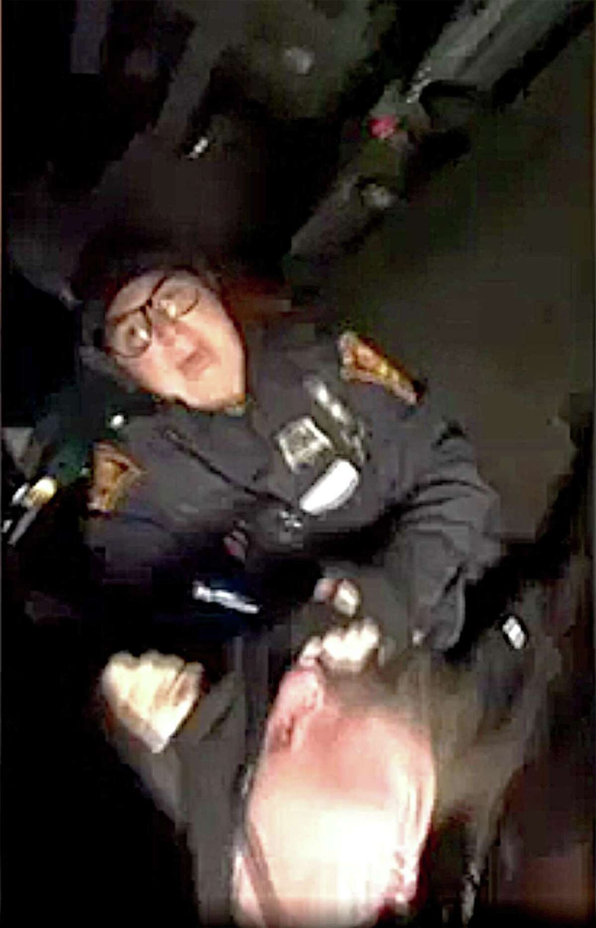 An image taken from a cell phone video shows Bridgeport Police Officer Christina Arroyo during the arrest of Aaron Kearney, 18, of Bridgeport following a traffic accident last Friday evening, Nov. 10, 2017. Arroyo and other officers have been placed on administrative status after allegations that they beat Kearney in the incident. Credit: Contributed