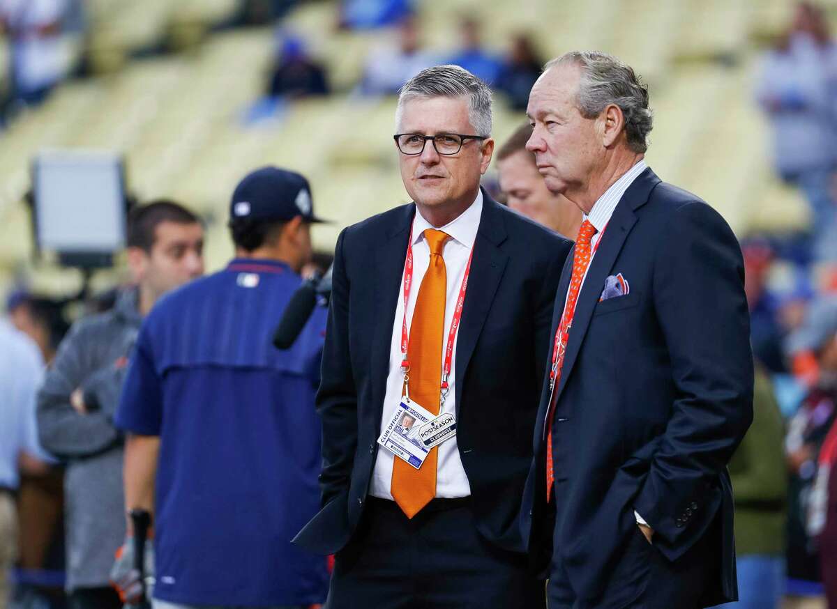 Former general manager Jeff Luhnow (left) had sued the Astros claiming owner Jim Crane (left) had struck a deal with MLB commissioner Rob Manfred to make Luhnow a scagegoat for the sign-stealing scandal.