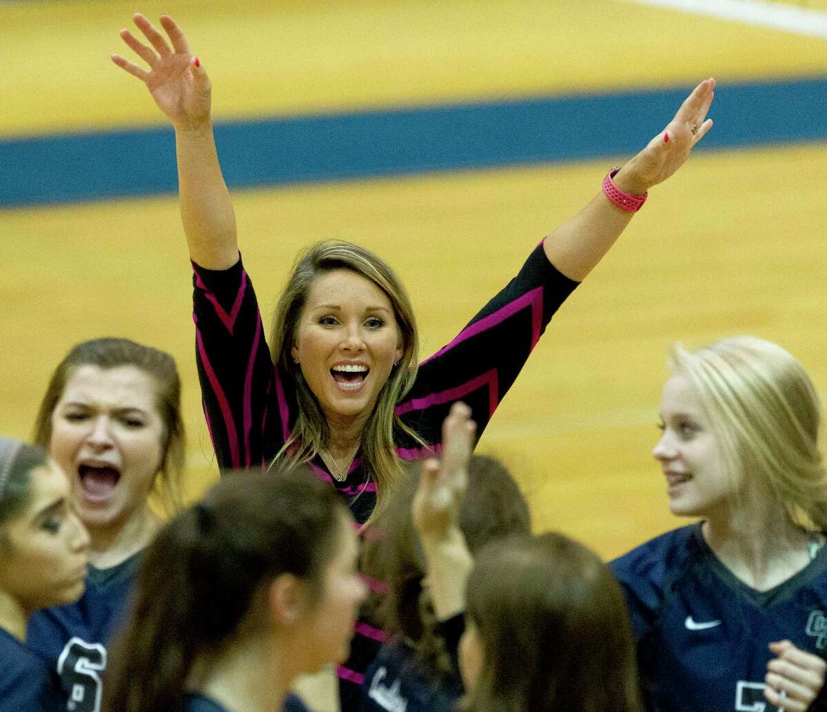 College Park head coach Candice Gibson celebrates with team's 3-1 win over Rockwall 3-1 duringa Region II-6A bi-district volleyball match at Leon High School, Tuesday, Oct. 31, 2017, in Jewett.