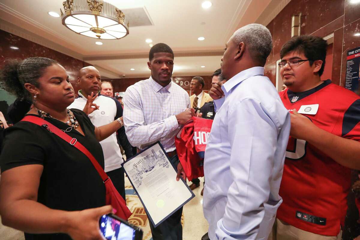 Andre Johnson, former Texans wide receiver, was honored with "Andre Johnson Day" by the City of Houston signs autographs as he leaves the Chamber Tuesday, Nov. 14, 2017, in Houston.