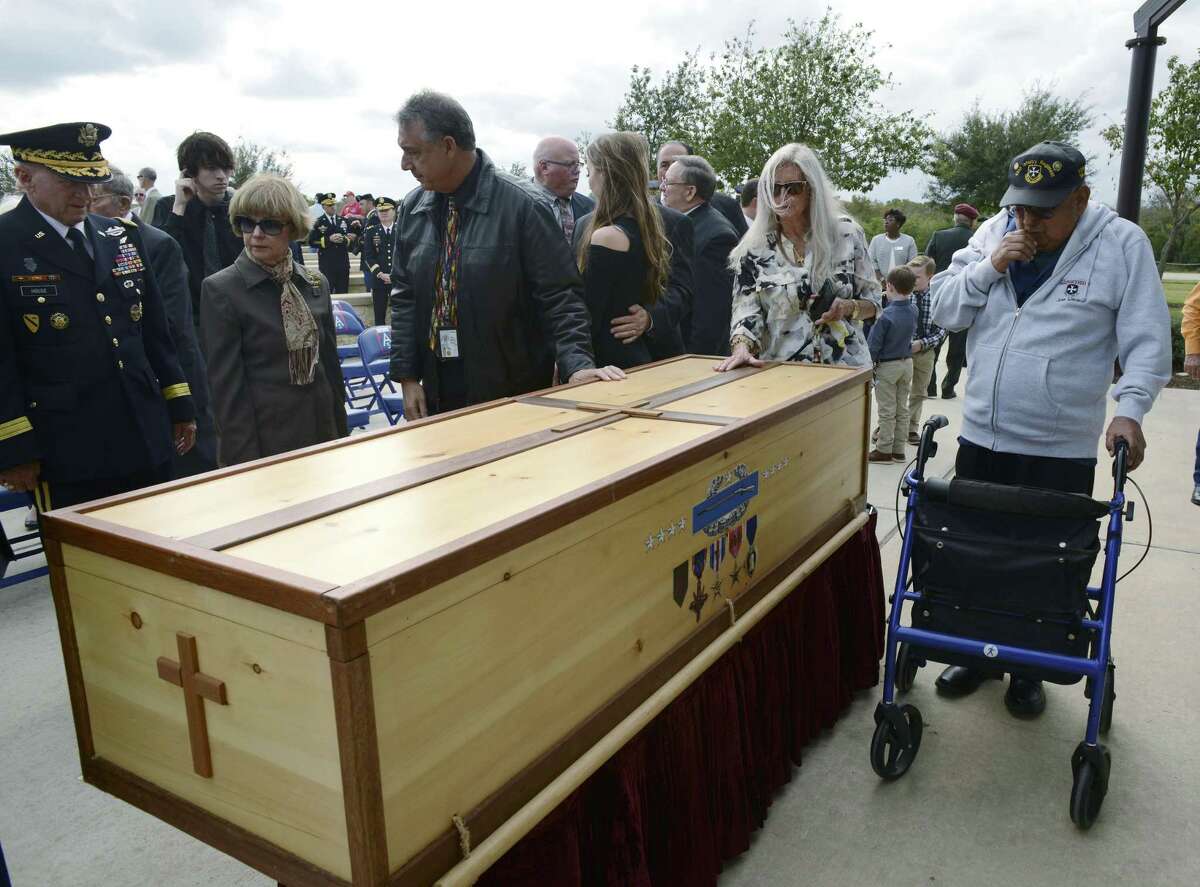 People pay their respects at the casket of Gen. Richard Cavazos, the Army's first Hispanic four-star General, at Fort Sam Houston National Cemetery on Tuesday, Nov. 14, 2017. Cavazos died on October 29 following a long illness. The casket was handmade by Ronnie Campsey, a Long Island restauranteur who served under Cavazos in Vietnam. It bears engravings of the medals Cavazos earned as a soldier, including two Distinguished Service Crosses, a Silver Star with Oak Leaf Cluster, Distinguished Flying Cross, the Bronze Star Medal with ?’V?“ device with four Oak Leaf Clusters, Purple Heart and Combat Infantry Badge. He retired in 1984 as the commanding general of U.S. Army Forces Command at Fort McPherson, Georgia. Prior to that, Cavazos commanded at every level of the Army, from platoon to Corps. A graduate of Texas Tech University's ROTC program, he served at Fort Hood on numerous occasions. Platoons from Fort Hood, Army North, Army South and the Army Medical Command were on hand for the burial.