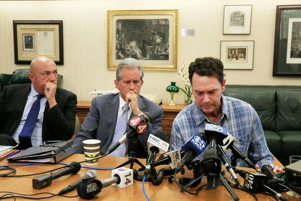 Greg Wilson (right), Sonoma County resident who lost his home in the North Bay fires, speaks during a press conference at Cotchett, Pitre & McCarthy as Frank Pitre (center), attorney Cotchett, Pitre & McCarthy, LLP and Khaldoun Baghdadi (left), attorney, Walkup, Melodia, Kelly & Schoenberger listen to Wilson speak at Cotchett, Pitre & McCarthy where lawsuits filed against PG &E on behalf of North Bay fire victims were announced on Tuesday, November 14, 2017 in Burlingame, Calif.