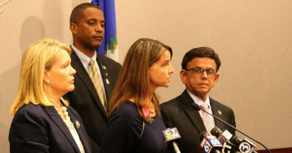 From left, state Sens. Heather Somers and George Logan and state Reps. Christie Carpino and Prasad Srinivasan speak during a press conference calling for a forum to address the recent allegations of patient abuse by Connecticut Valley Hospital employees in Middletown.