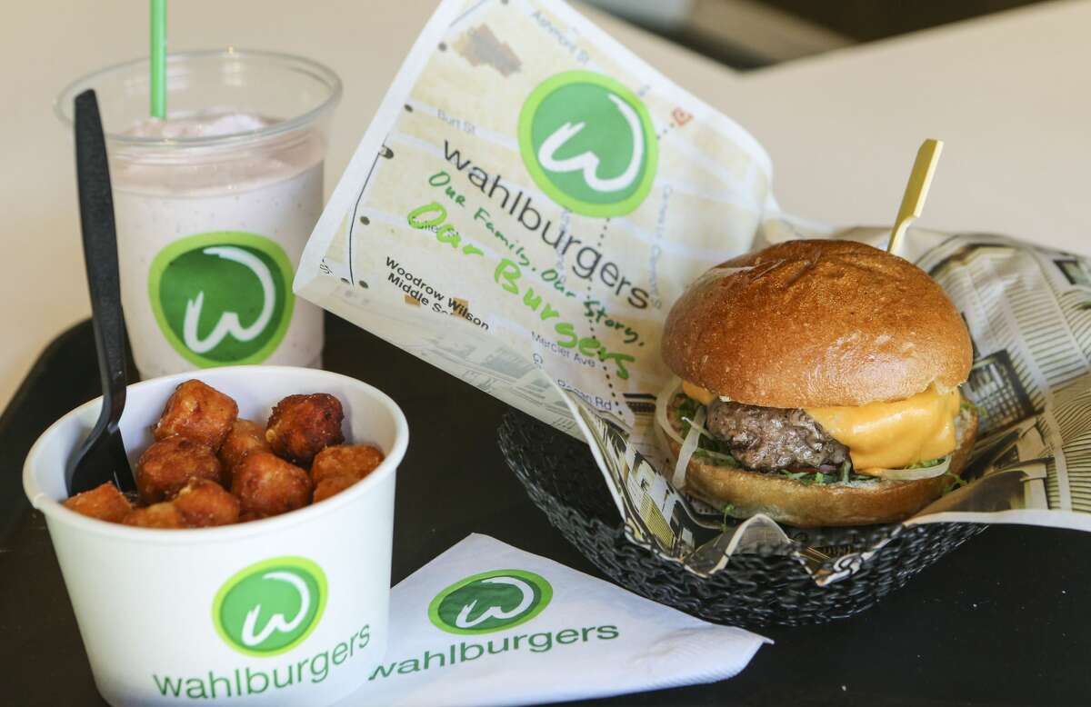 TORONTO, ON- OCTOBER 23 The "Our Burger", Sweet potato tots, and the Funky Monkey Adult Frappe at a Wahlburgers restaurant in Canada on November 15, 2014. 