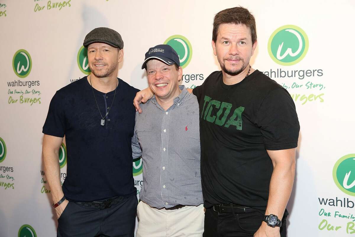 NEW YORK, NY - JUNE 23: (L-R) Donnie Wahlberg, Paul Wahlberg and Mark Wahlberg attend the Wahlburgers Coney Island VIP Preview Party at Wahlburgers Coney Island on June 23, 2015 in New York City. 