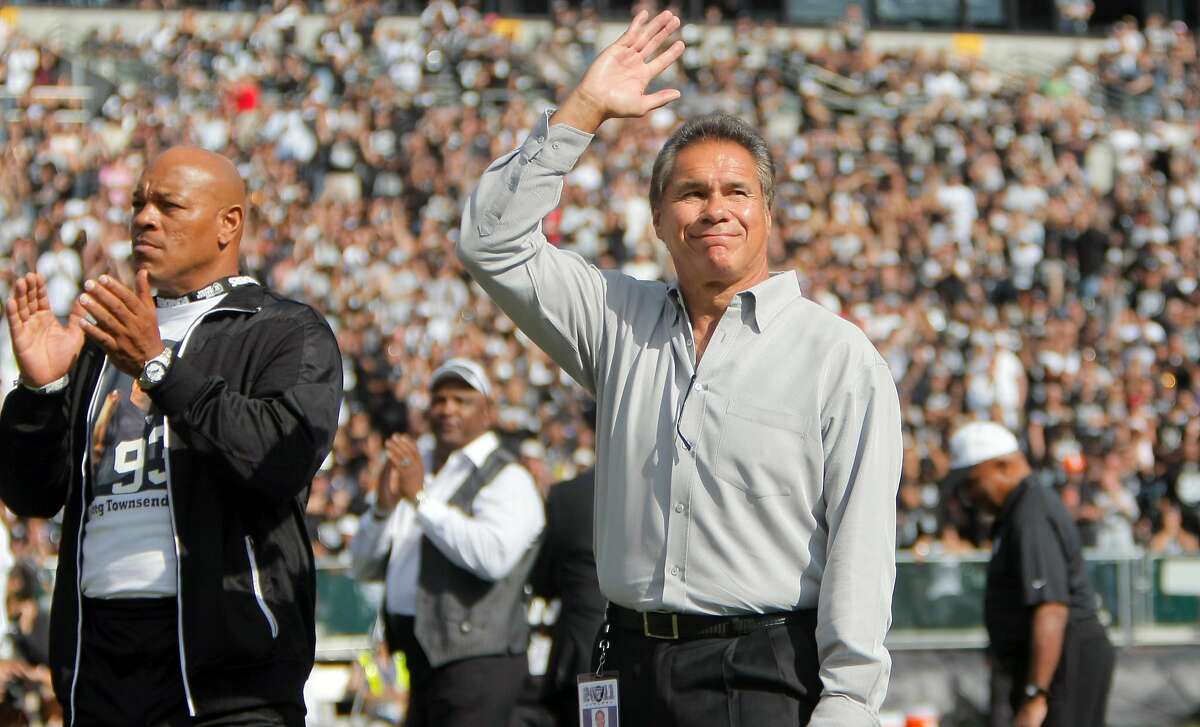 Former Raider Jim Plunkett waves to the crowd during a half time ceremony honoring Al Davis at the O.co Coliseum in Oakland. Calif., on Sunday, Oct. 16, 2011. The Raiders would win the game, 24-17.Former Raider Jim Plunkett waves to the crowd during a half time ceremony honoring Al Davis at the O.co Coliseum in Oakland. Calif., on Sunday, Oct. 16, 2011. The Raiders would win the game, 24-17.
