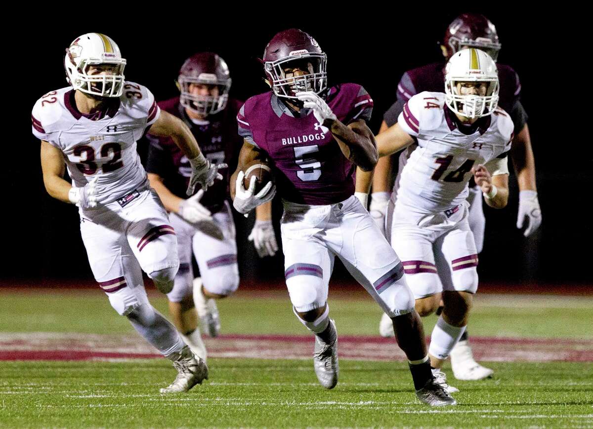 Magnolia running back Anthony Johnson (5) runs for a 43-yard touchdown during the fourth quarter of a District 20-5A high school football game, Friday Oct. 20, 2017, in Magnolia.