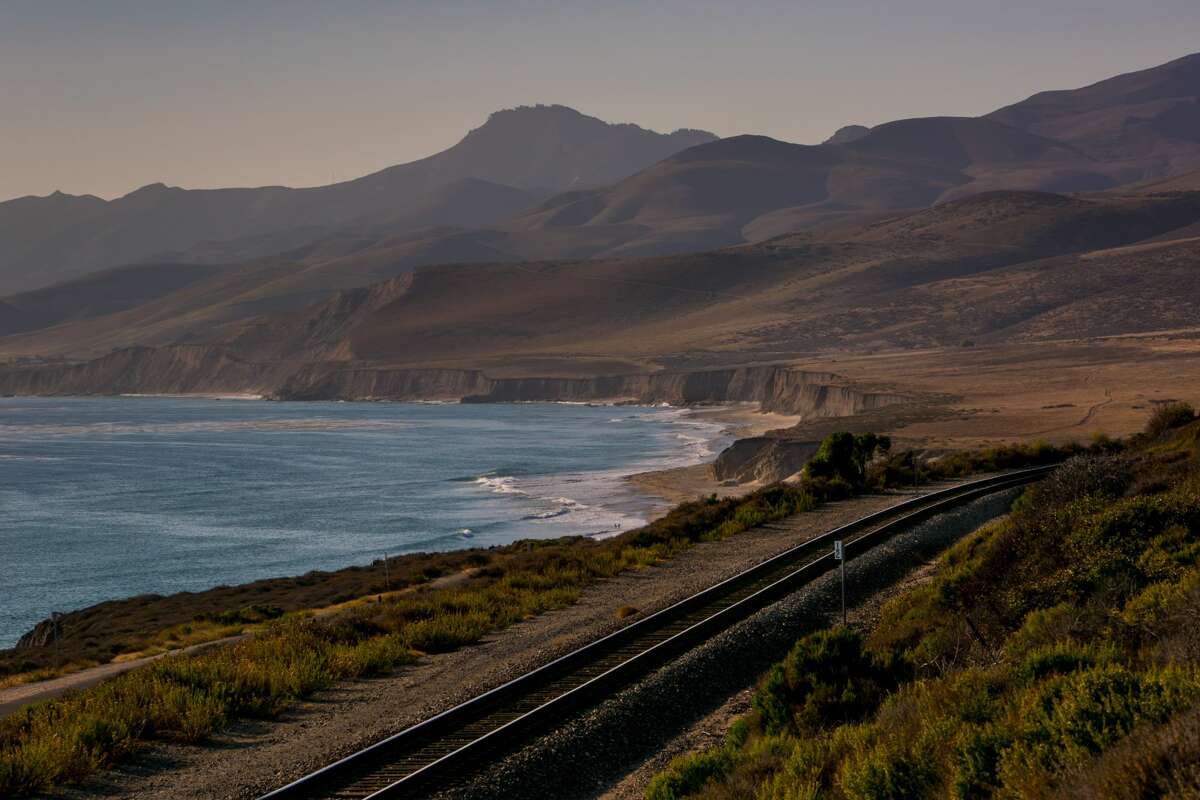 An Amtrak train track hugs the rugged California coastline as viewed on August 9, 2015, in Jalama Beach, California.
