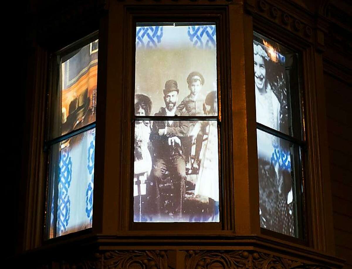Windows of Haas-Lilienthal house with video projection by Ben Wood