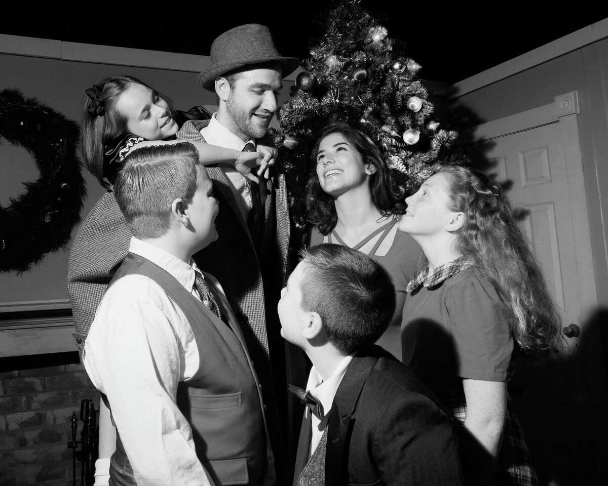 The cast of Landmark Community Theater's production of  "It?’s A Wonderful Life" re-create the iconic end shot of the film. From top: Madeline Roberts as ?“Zuzu Bailey,?” Rob Girardin as ?“George Bailey,?” Jenny Dressel as ?“Mary Bailey,?” Abby Stanford as ?“Janie Bailey,?” Lucas Peck as ?“Tommy Bailey,?” and Ethan Wollman as ?“Peter Bailey.?”