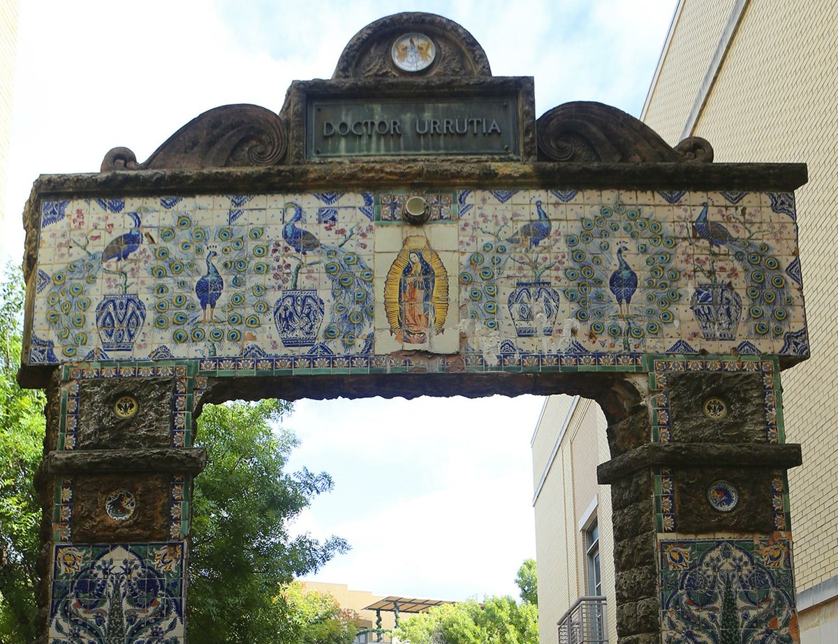 This large arched gate was once a part of the gardens called Miraflores. A large concrete and tile gate led to Miraflores, a private garden owned by Urrutia at the corner of Broadway and Hildebrand. It was a short walk from Quinta Urrutia, the doctor's home, which was located south of the garden on Broadway and was separated from Miraflores by some unrelated acreage.