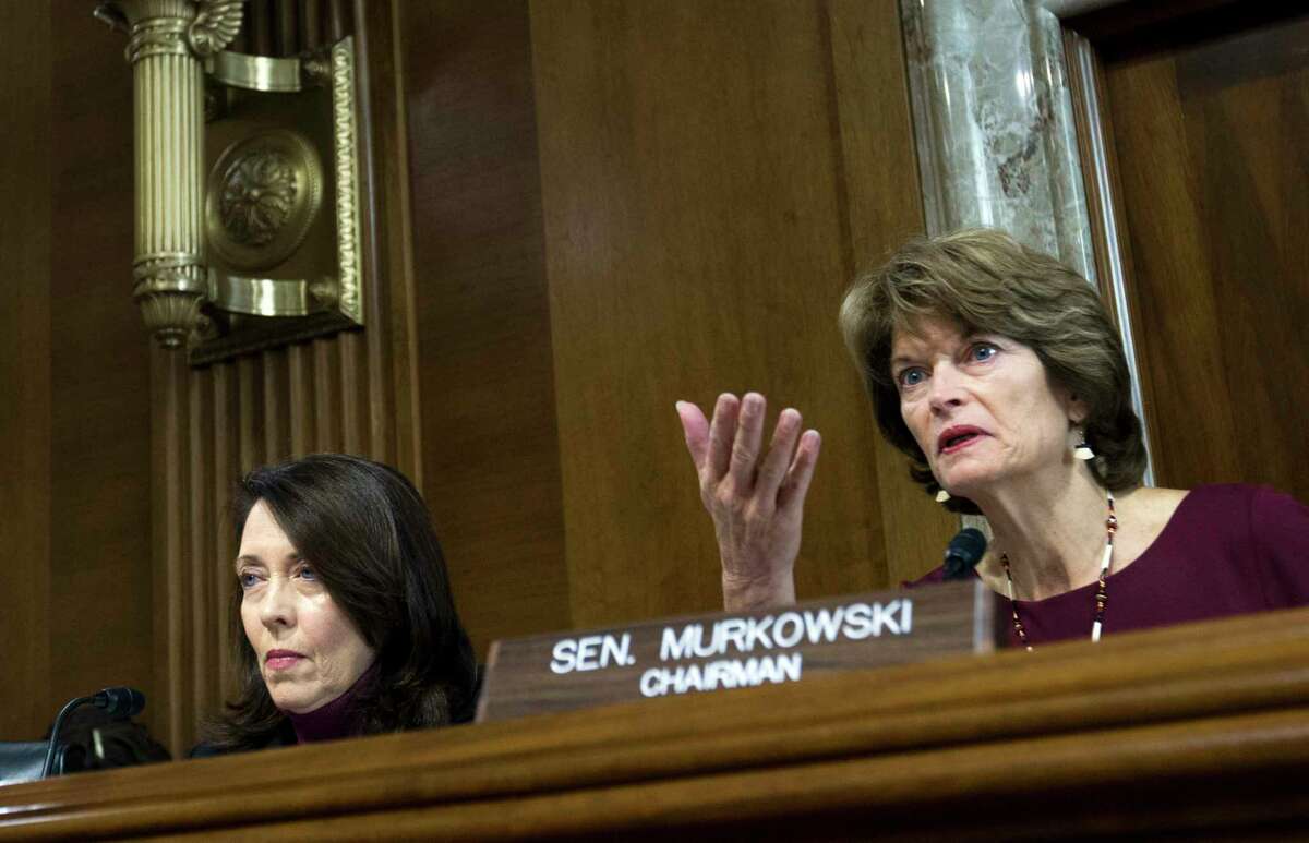 Senate Energy and Natural Resources Committee Chair Sen. Lisa Murkowski, R-Alaska, right, speaks as committee's ranking member Sen. Maria Cantwell, D-Wash., looks on, during a hearing on Capitol Hill in Washington, Wednesday, Nov. 15, 2017. Oil and gas drilling in Alaska's Arctic National Wildlife Refuge moved closer Wednesday as a key Senate panel approved a bill to open the remote refuge to energy exploration. The Senate Energy and Natural Resources Committee approved the drilling measure, 13-10. ( AP Photo/Jose Luis Magana)