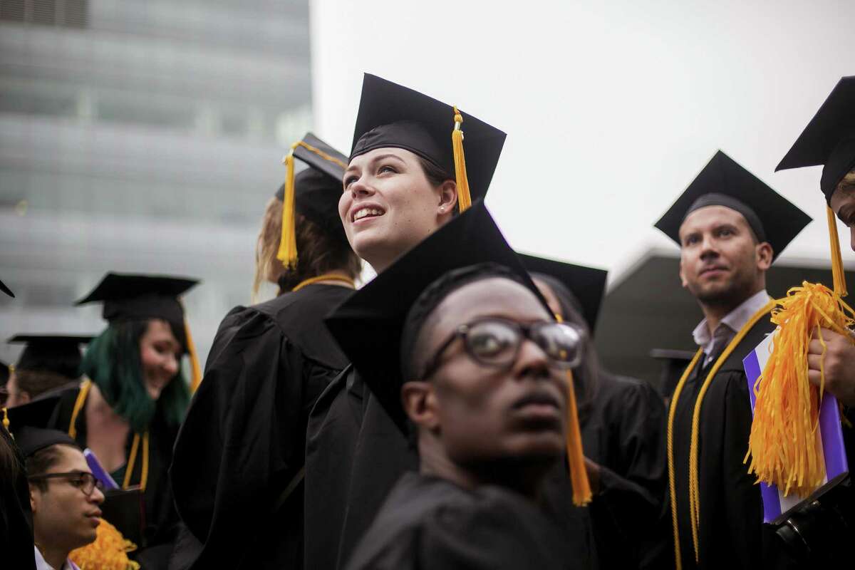 Students from City College of New York wait to hear first lady Michelle Obama speak at their 2016 graduation ceremony. A proposed federal tax overhaul could affect large university endowments and graduate student tuition costs, leaving higher education groups worried about the potential impact on student costs and university finances.