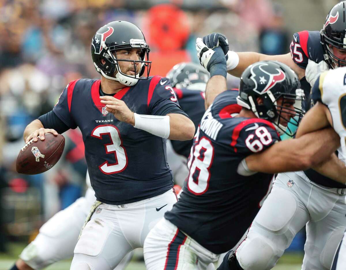 Tom Savage tries to get the ball on its way before the Rams' pass rush gets to him. The Texans quarterback knows he has work to do in that regard.