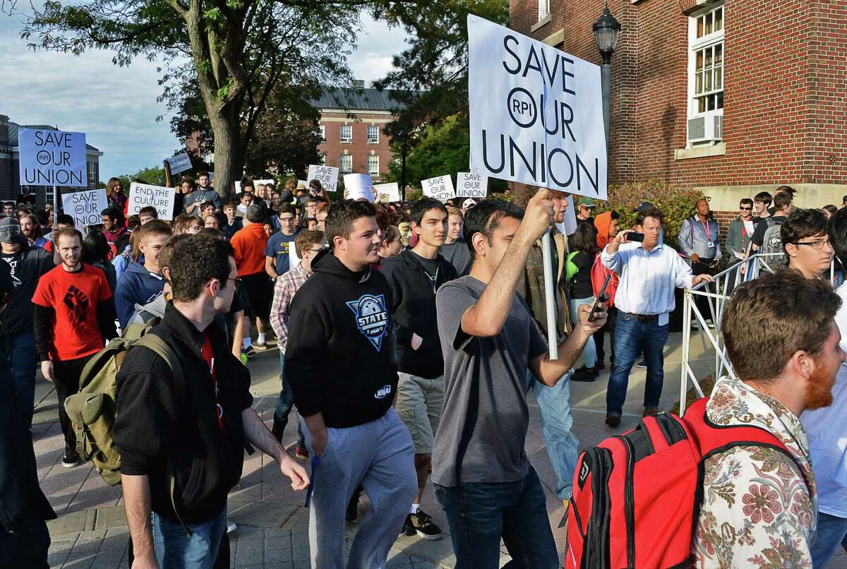 Student protesters push past a barricade and stream out into campus as they demonstrate against the RPI administration for not respecting their free-speech right Friday Oct. 13, 2017 in Troy, NY. (John Carl D'Annibale / Times Union)
