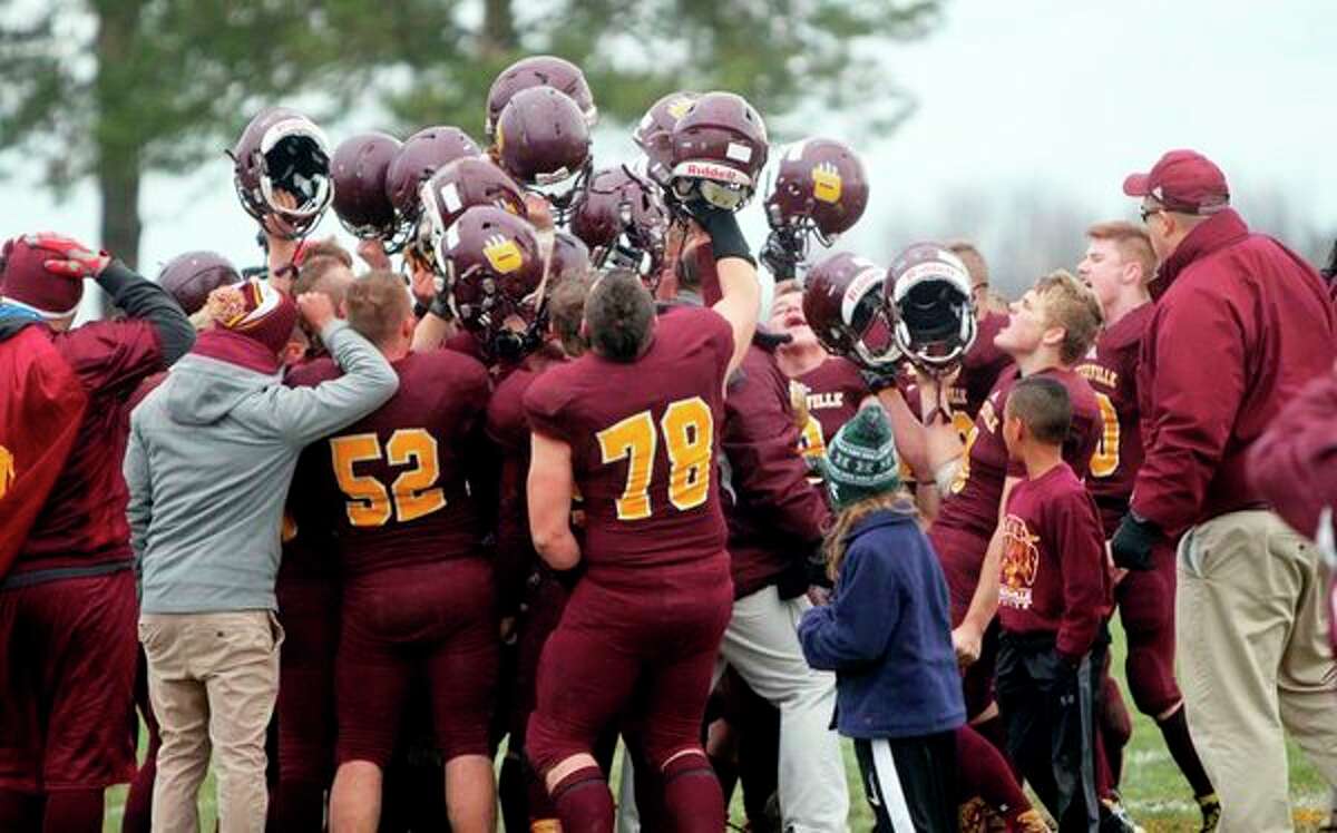 The Deckerville football celebrates following its win Saturday over Bellevue. The win advanced the team to the state championship game for the second straight year. (Seth Stapleton/Huron Daily Tribune)