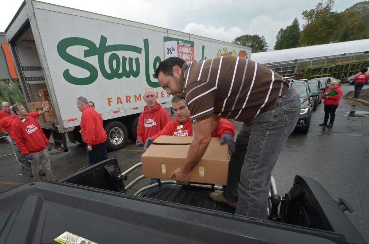 Norwalk Community Health Center facilities manager Cesar Ramos receives cases of frozen turkeys as Stew Leonard?’s continues its long-standing tradition of giving thanks to the communities it serves with its 38th Annual ?“Turkey Brigade?” Thursday, November 16, 2017, in Norwalk, Conn. The store gave away over 200 frozen turkeys to 33 organizations and over in Norwalk and 2,500 were distributed to more than 100 churches, civic groups, elderly housing and senior nutrition programs, and schools from all their stores in the Norwalk, Newington & Danbury, Connecticut and East Meadow, Farmingdale & Yonkers, New York.
