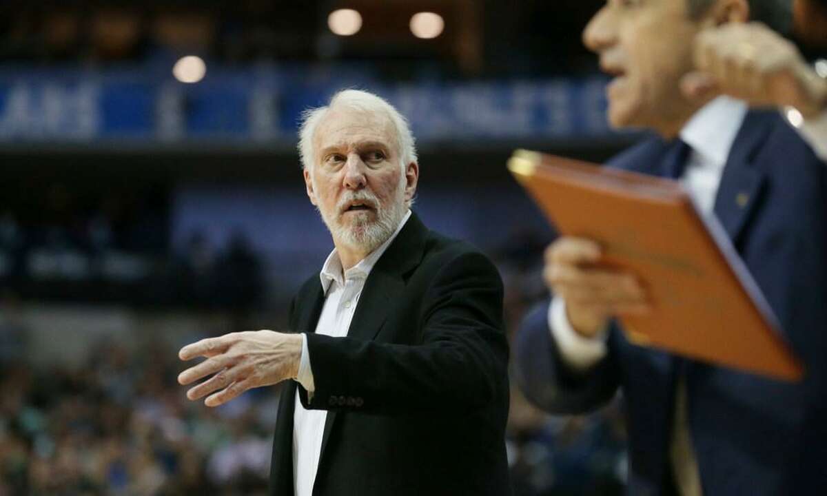 San Antonio Spurs head coach Gregg Popovich walks the sidelines during the second half of an NBA basketball game against the Dallas Mavericks in Dallas, Tuesday, Nov. 14, 2017. The Spurs won 97-91.