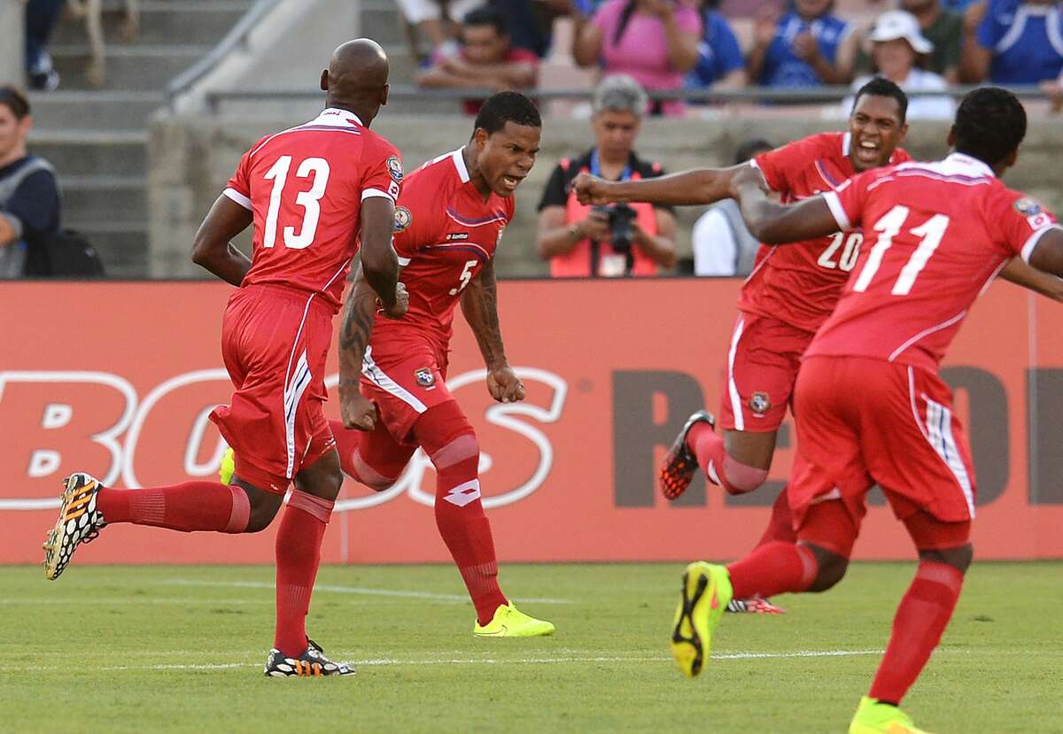 Panama's captain Roman Torres, 5, (2L) celebrates with teammates after scoring a goal in the early minutes against El Salvador's during their Central American Cup Tigo 2014 USA Third Place Match at the LA Memorial Coliseum in Los Angeles on September 13, 2014. From left to right: Adolfo Machado, 13, Roman Torres, Roberto Nurse, 20, and Armando Cooper, 11. AFP PHOTO / Robyn Beck (Photo credit should read ROBYN BECK/AFP/Getty Images)